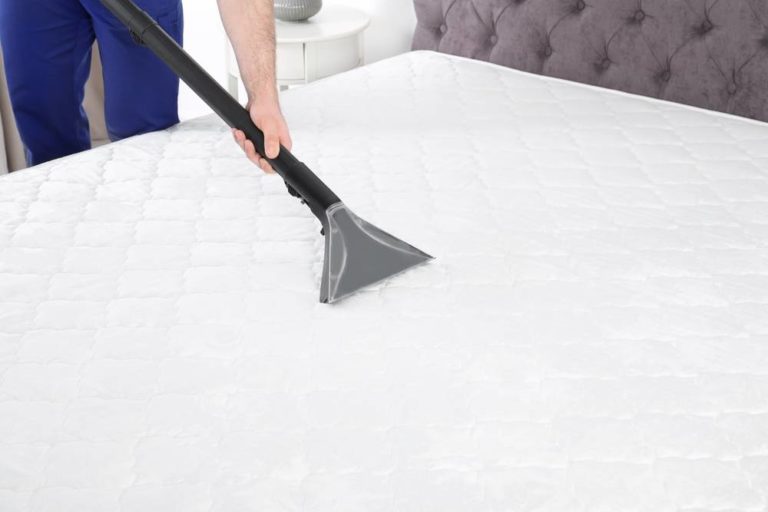 Man,Disinfecting,Mattress,With,Vacuum,Cleaner,,Closeup.,Space,For,Text